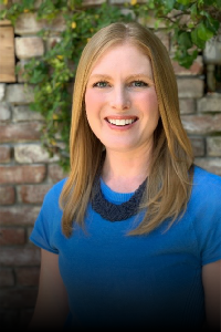 Shellena Heber wearing a blue shirt wiht a black necklace